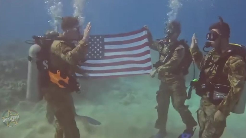 SFC. Juan Pina leads an underwater reenlistment ceremony. (Screenshot via U.S Army W.T.F! Moments)